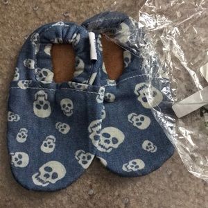 Brand new skull moccasins. Size 8-24 month chambray color